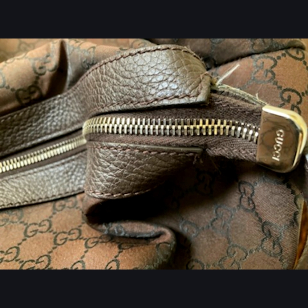 A gucci carry on bag